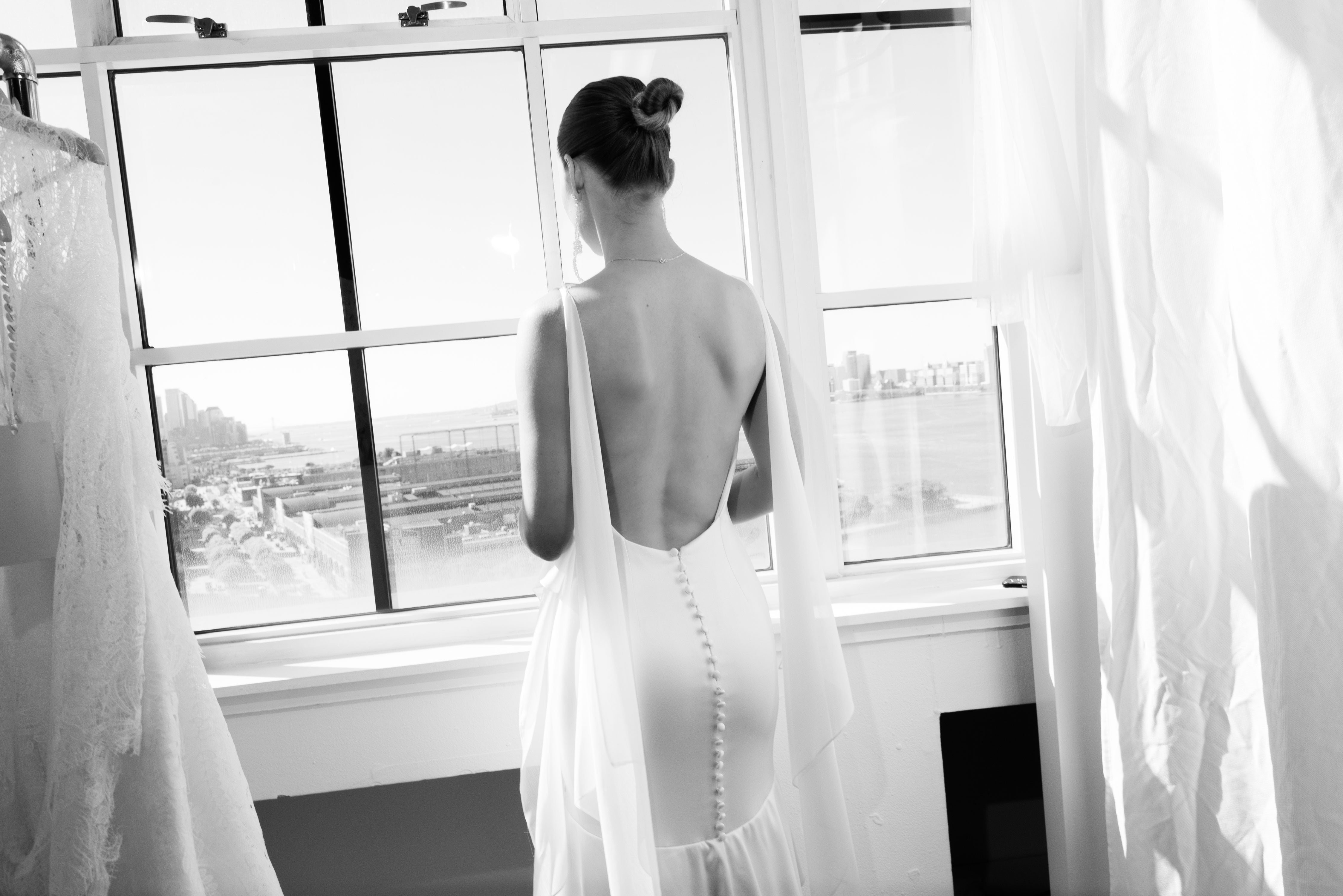 A woman at enjoying the view at Canoe Studios in New York City during the New York Bridal Fashion Week