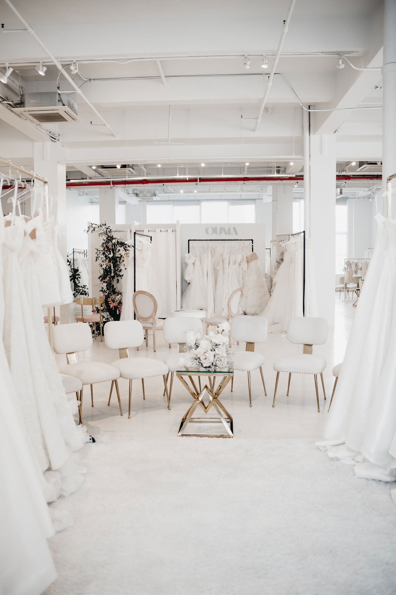 Modern white interior with furniture and decor elements bridal designer space at the One Fine Day Bridal Market