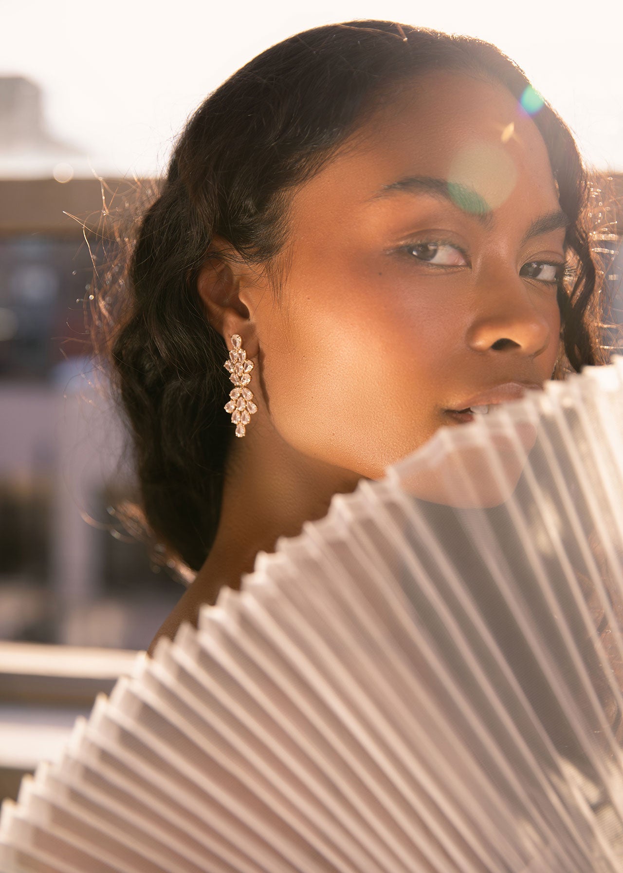 Woman holding a striped fabric with blurred background